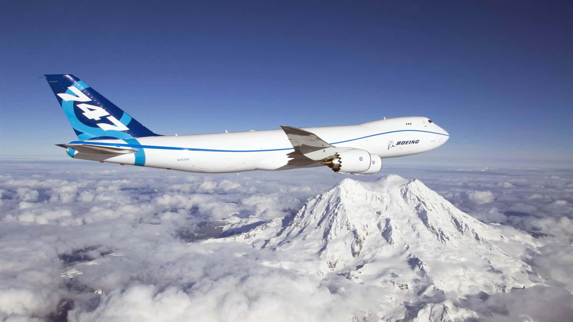 A Plane Flying Over A Mountain Background