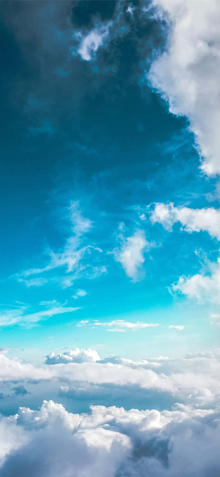 A Plane Flying Over The Clouds Background
