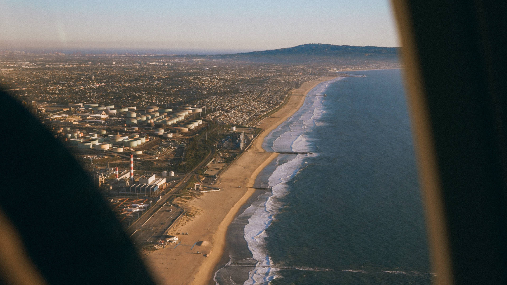 A Plane Window Shot Of A Wide Shoreline