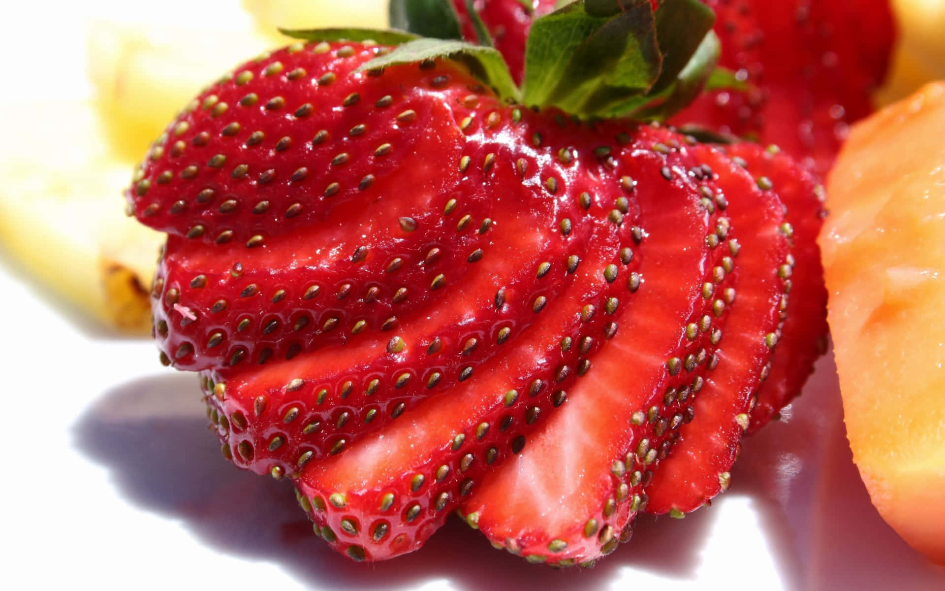 A Plate Of Fruit With Strawberries And Pineapple Background