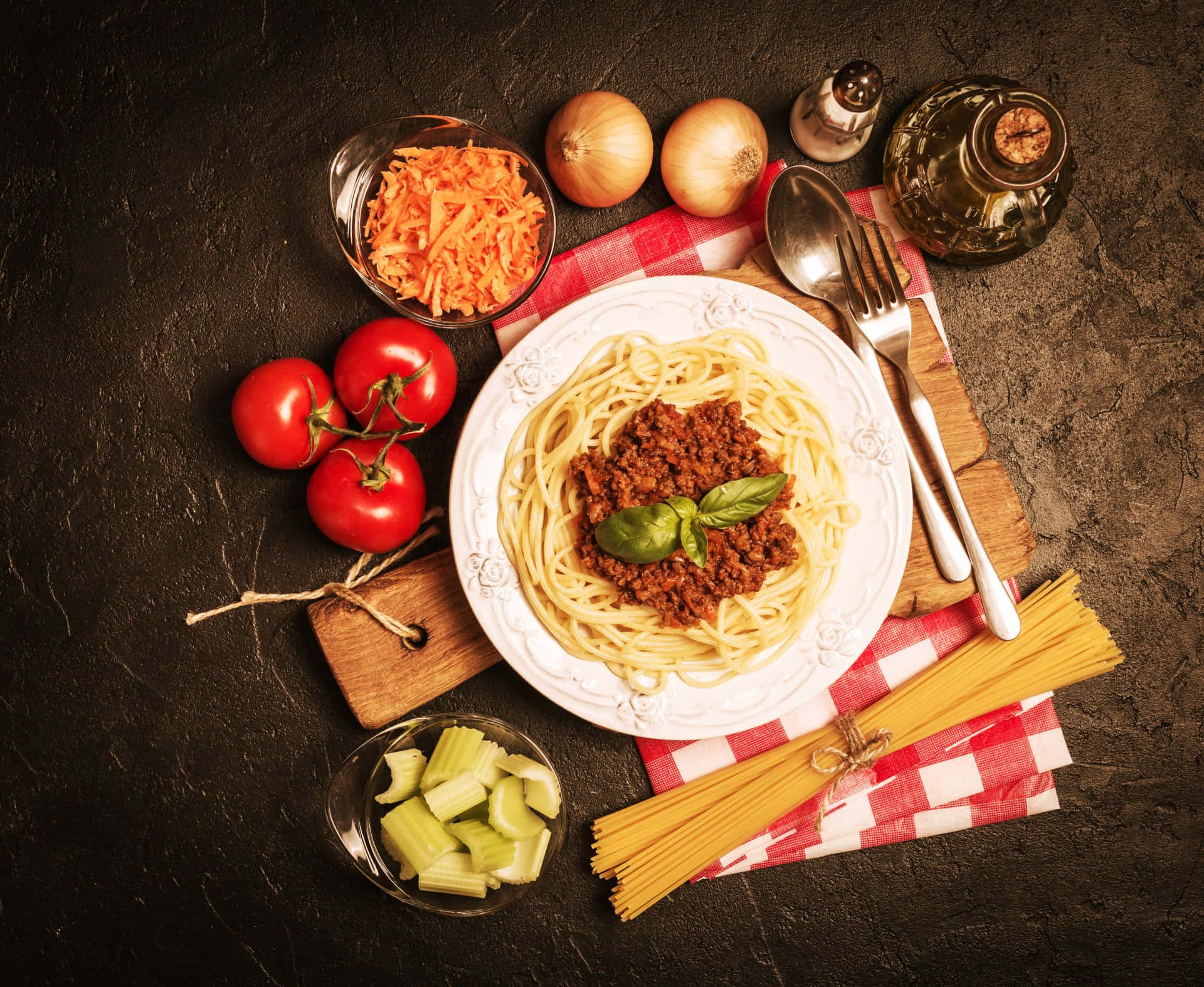 A Plate Of Spaghetti With Meat Sauce And Vegetables Background