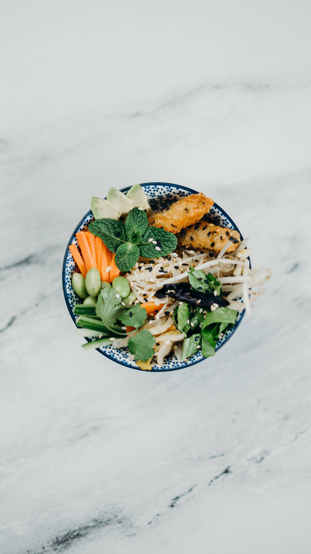 A Plate Of Vegetables On A Marble Table Background