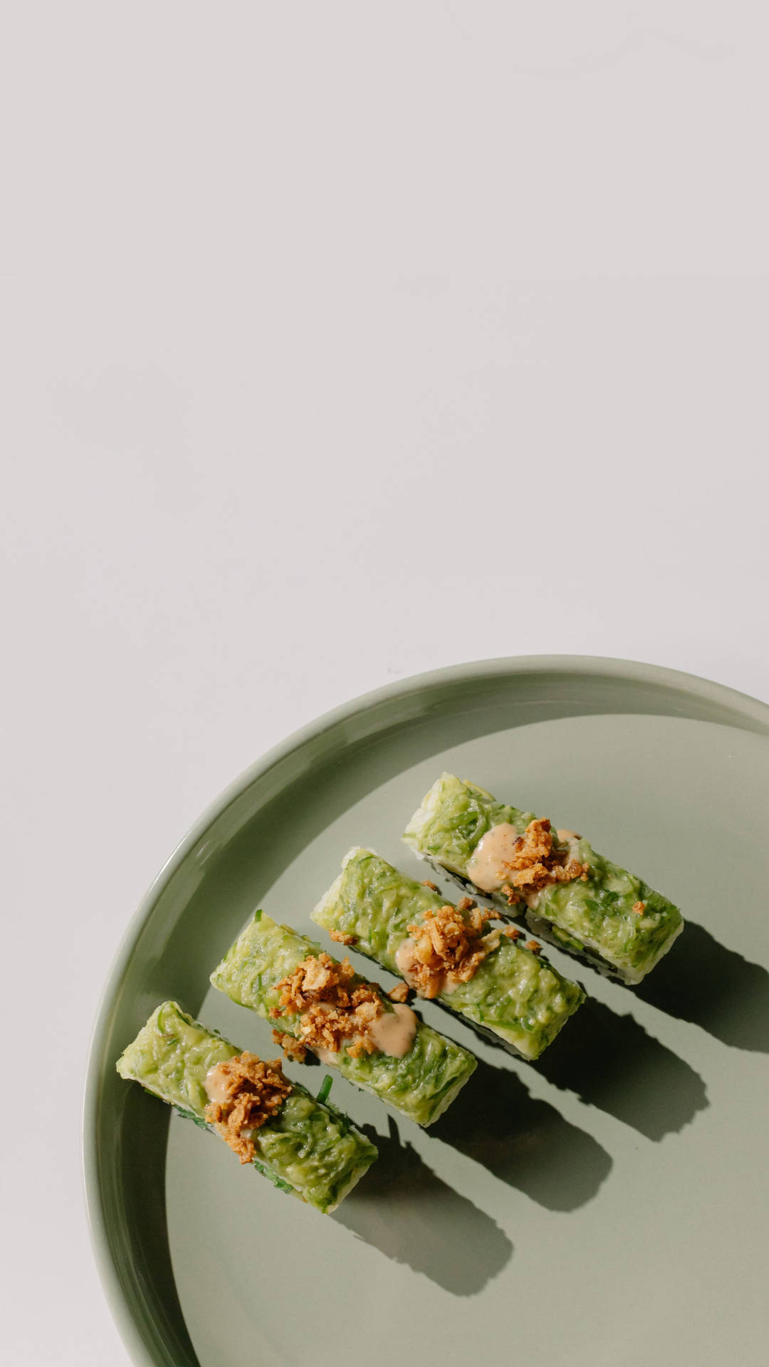 A Plate With Green Food On It Background