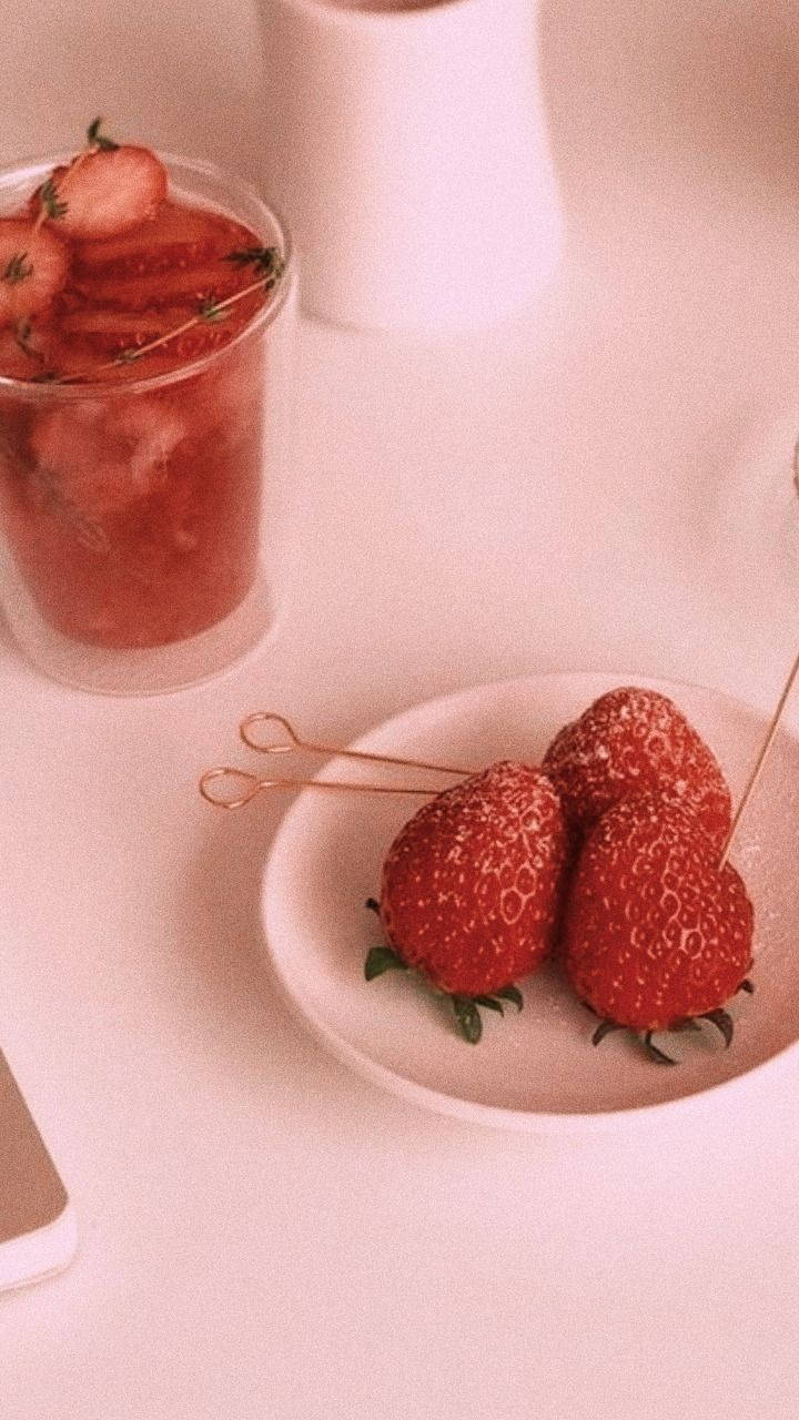 A Plate With Strawberries And A Cup Of Coffee Background