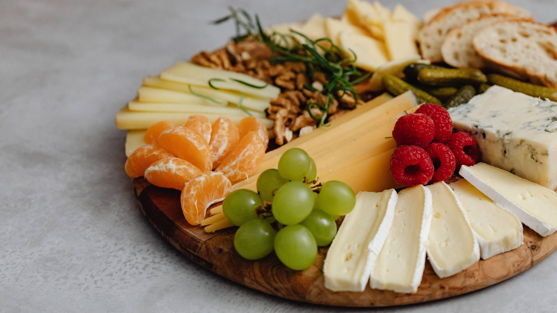 A Platter Of Cheese, Fruit, And Nuts Background