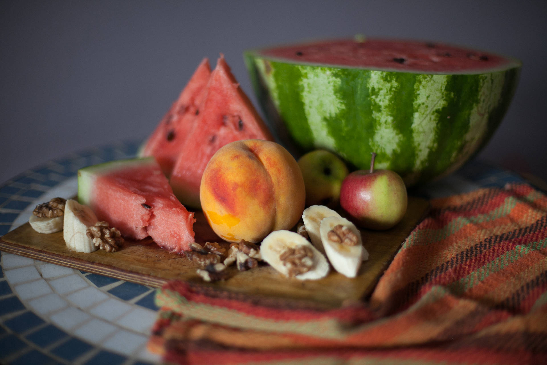 A Platter Of Fruits On Wooden Tray Background