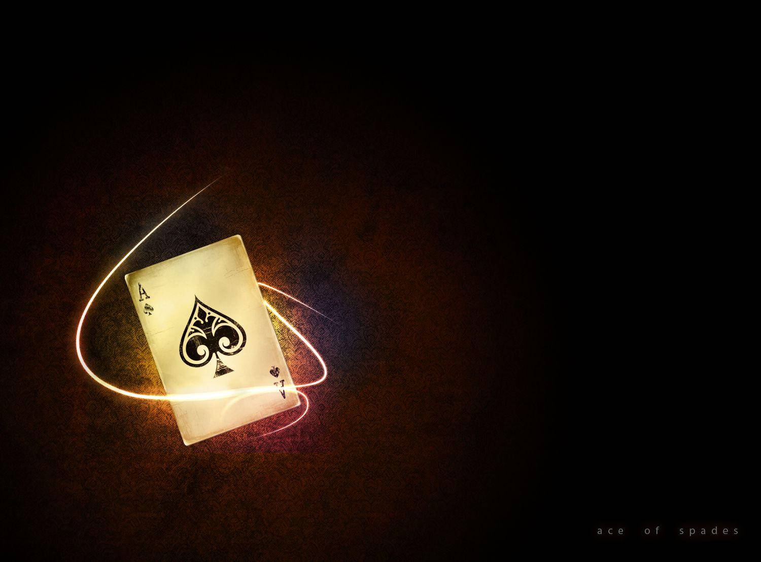 A Playing Card With A Light Shining On It Background