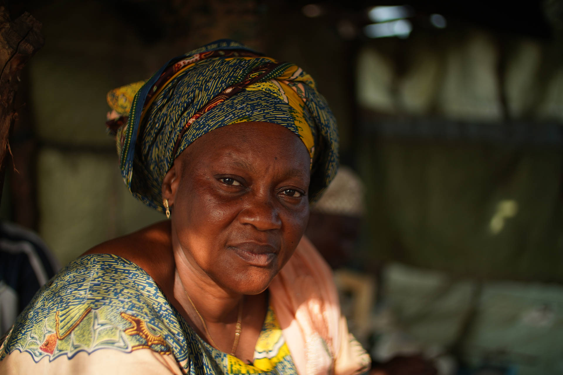 A Portrait Of Grace - Elderly Woman With Traditional Head Tie Background