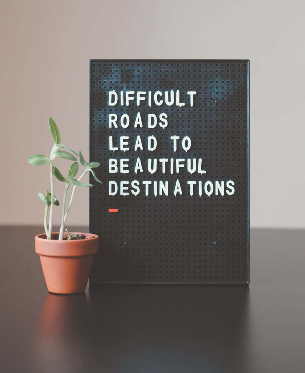 A Poster With The Words Difficult Roads Lead To A Wonderful Destination