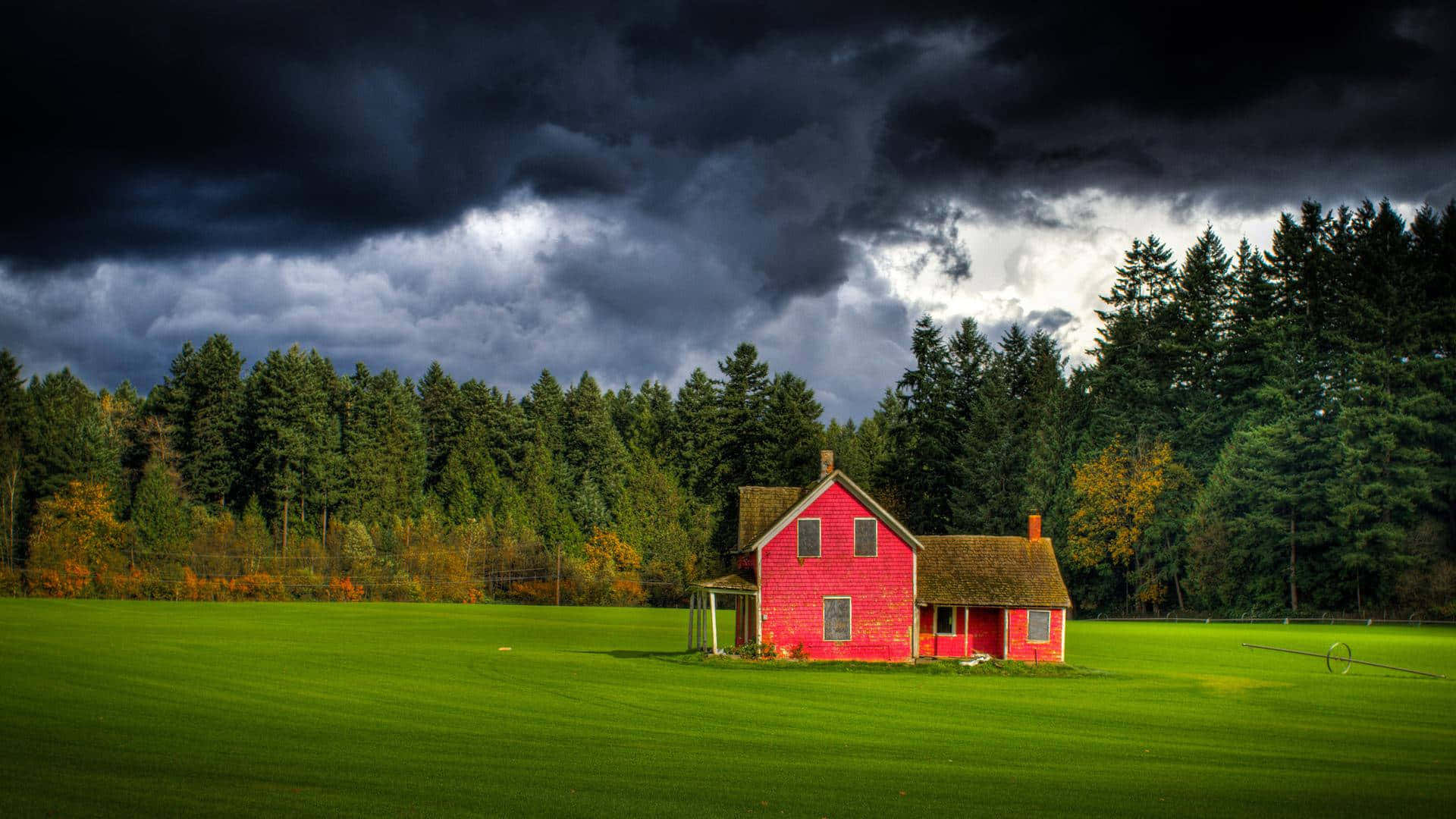 A Pristine Farmhouse In The Middle Of A Serene Meadows Background