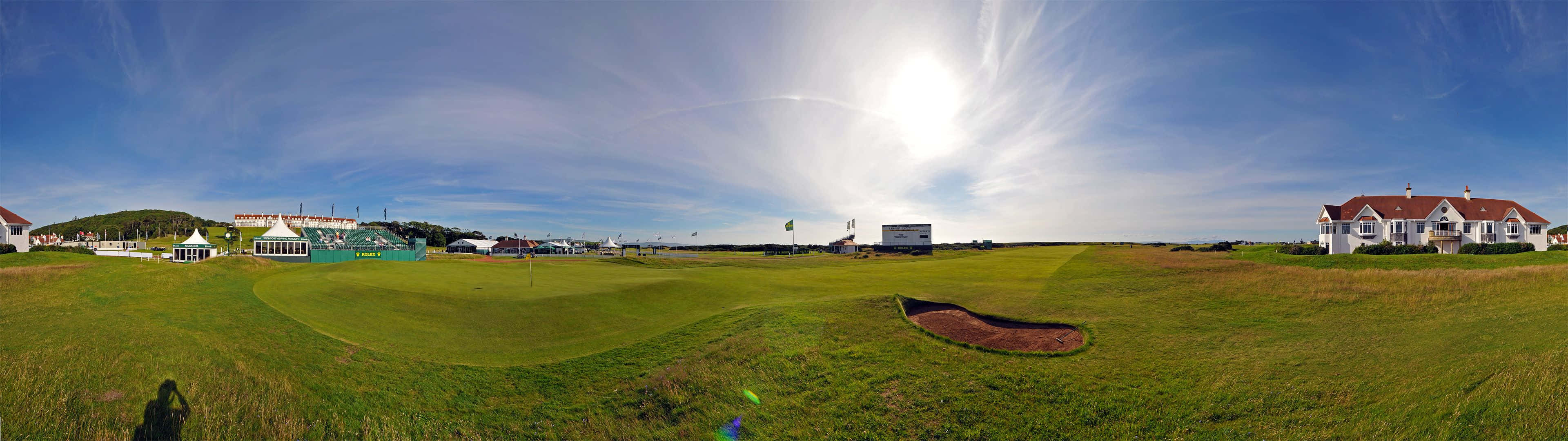 A Professional Golfer Practices His Technique On The Green. Background