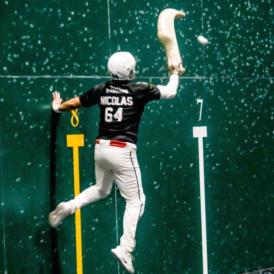 A Professional Jai Alai Player In Action Background