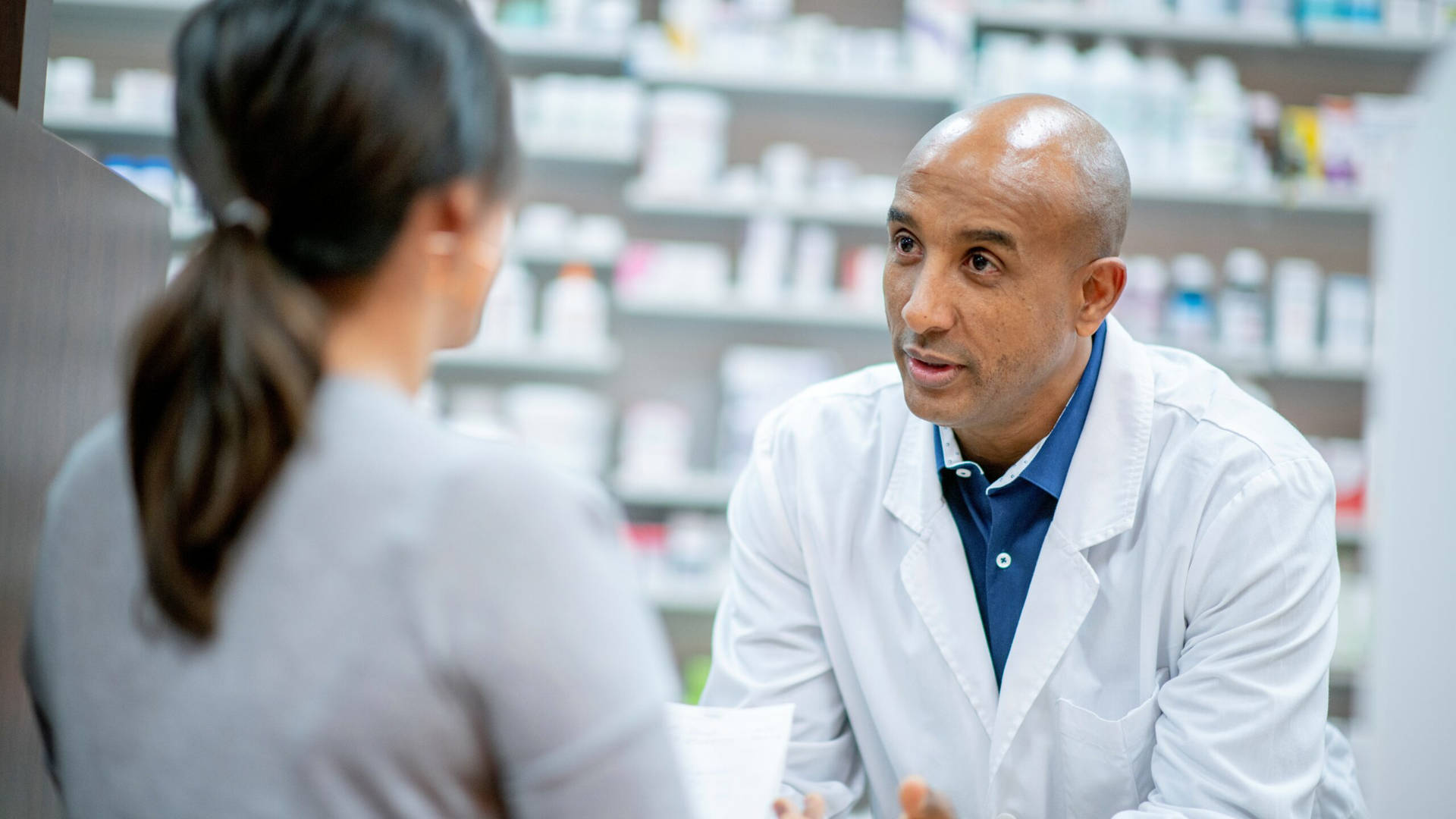 A Professional Pharmacist Consulting With A Customer