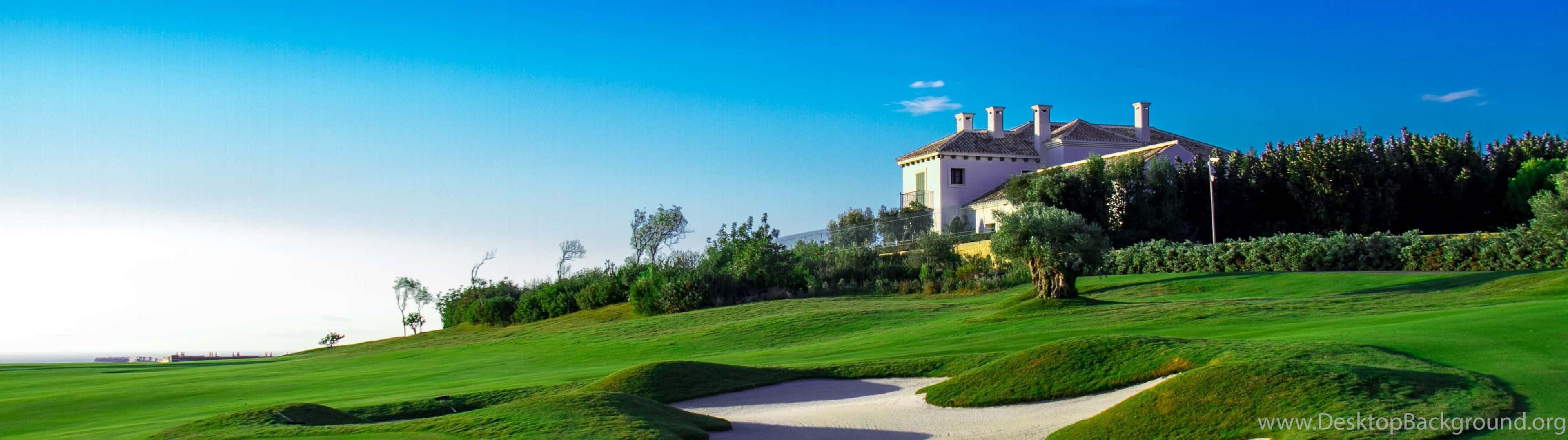 A Professional Taking Aim In A Golf Course Background