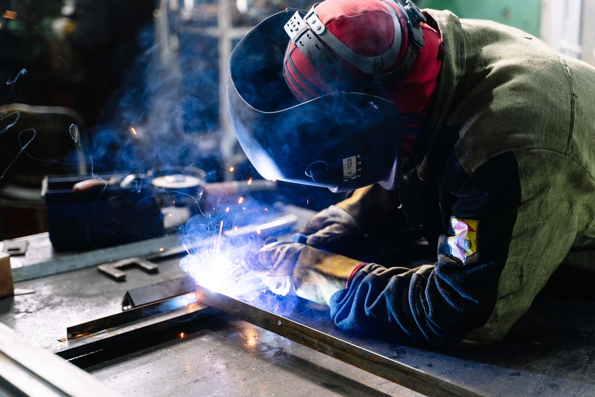 A Professional Welder Perfecting His Craft Background