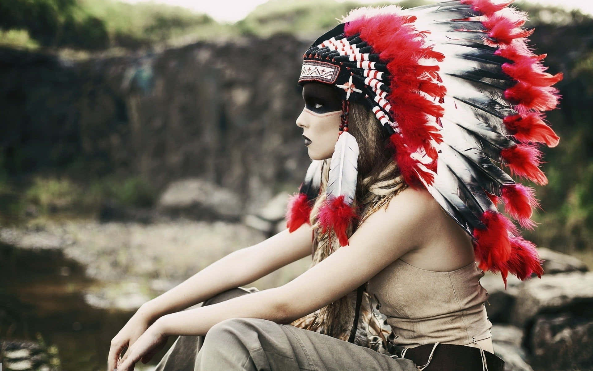 A Profile Of An Empowered Woman Wearing An Indian Warbonnet Background