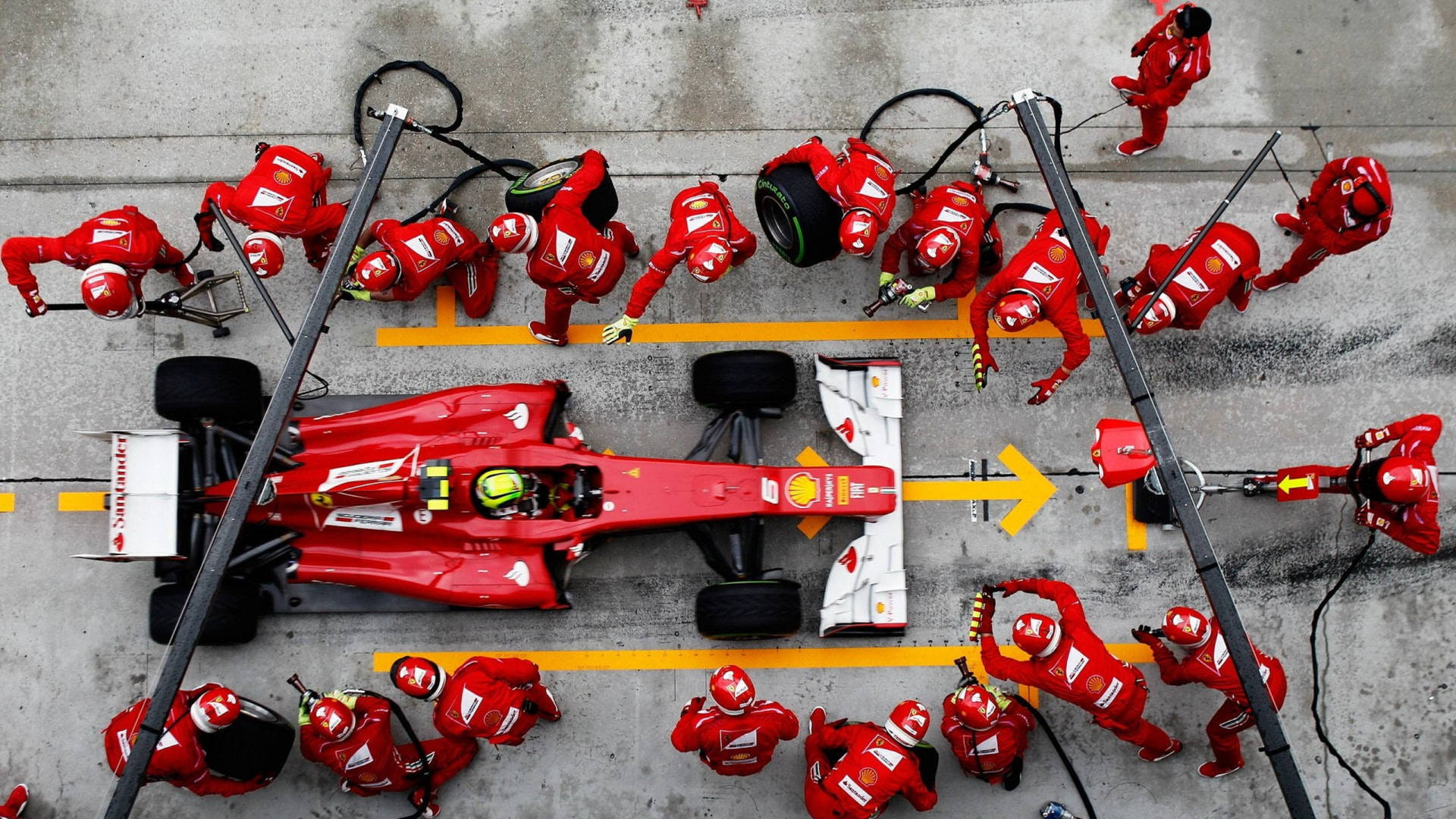 A Pulse-racing Moment At A F1 Pit Stop Background