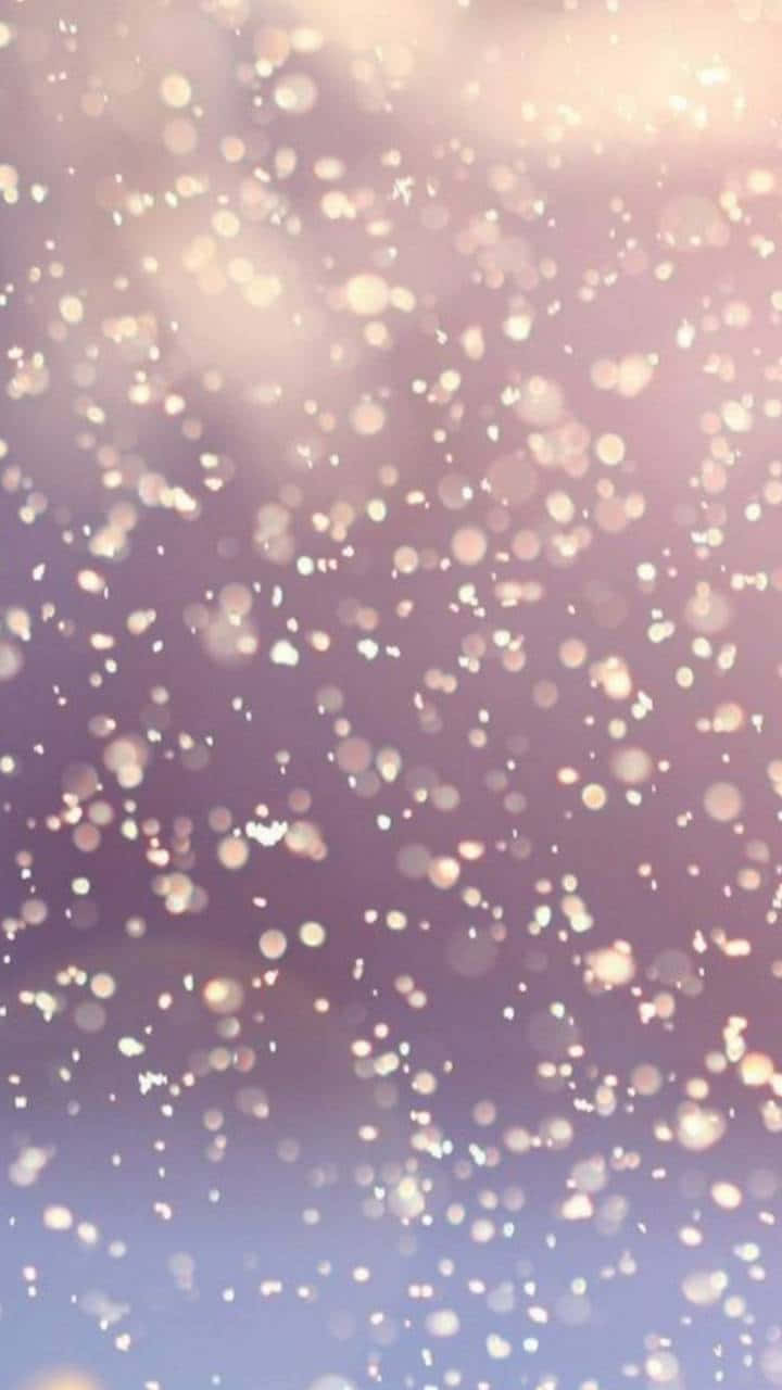 A Purple And Pink Background With Snowflakes
