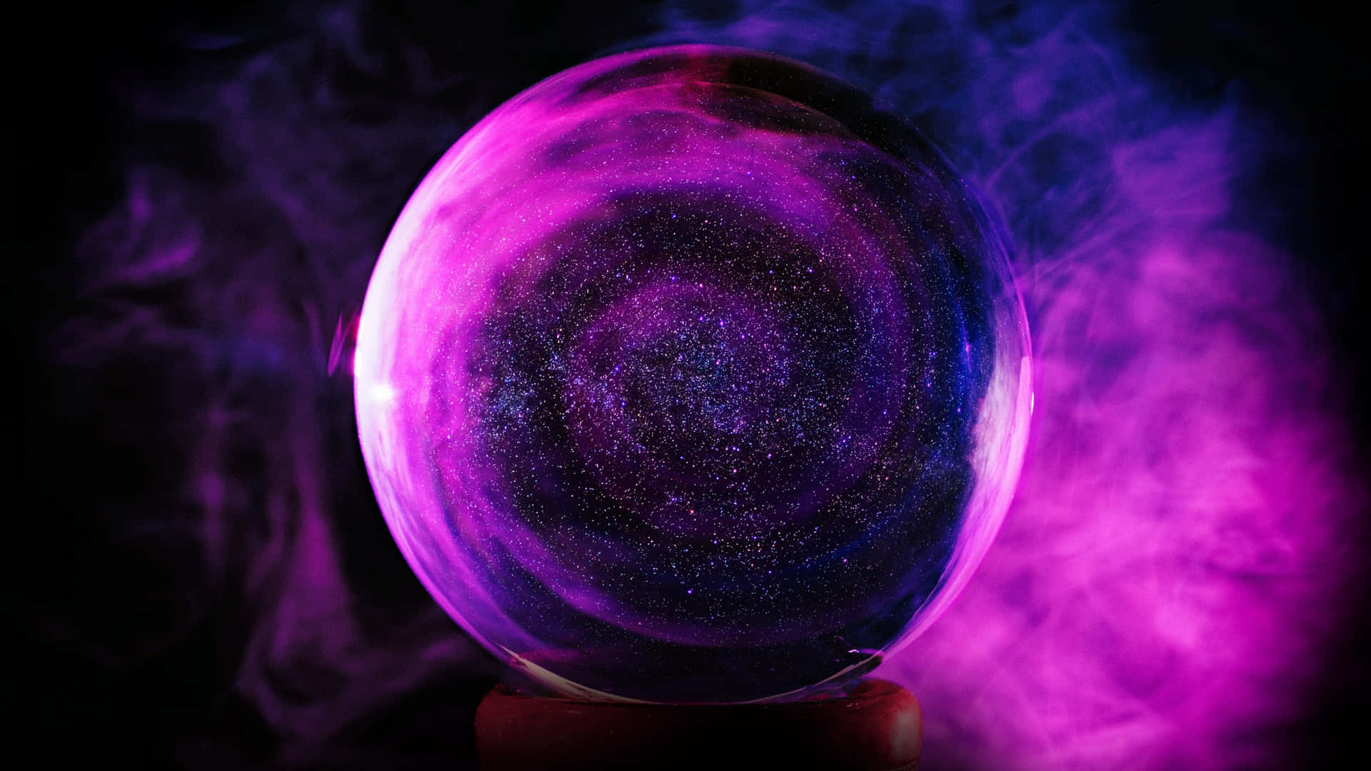 A Purple And Pink Crystal Ball With Smoke Coming Out Of It Background