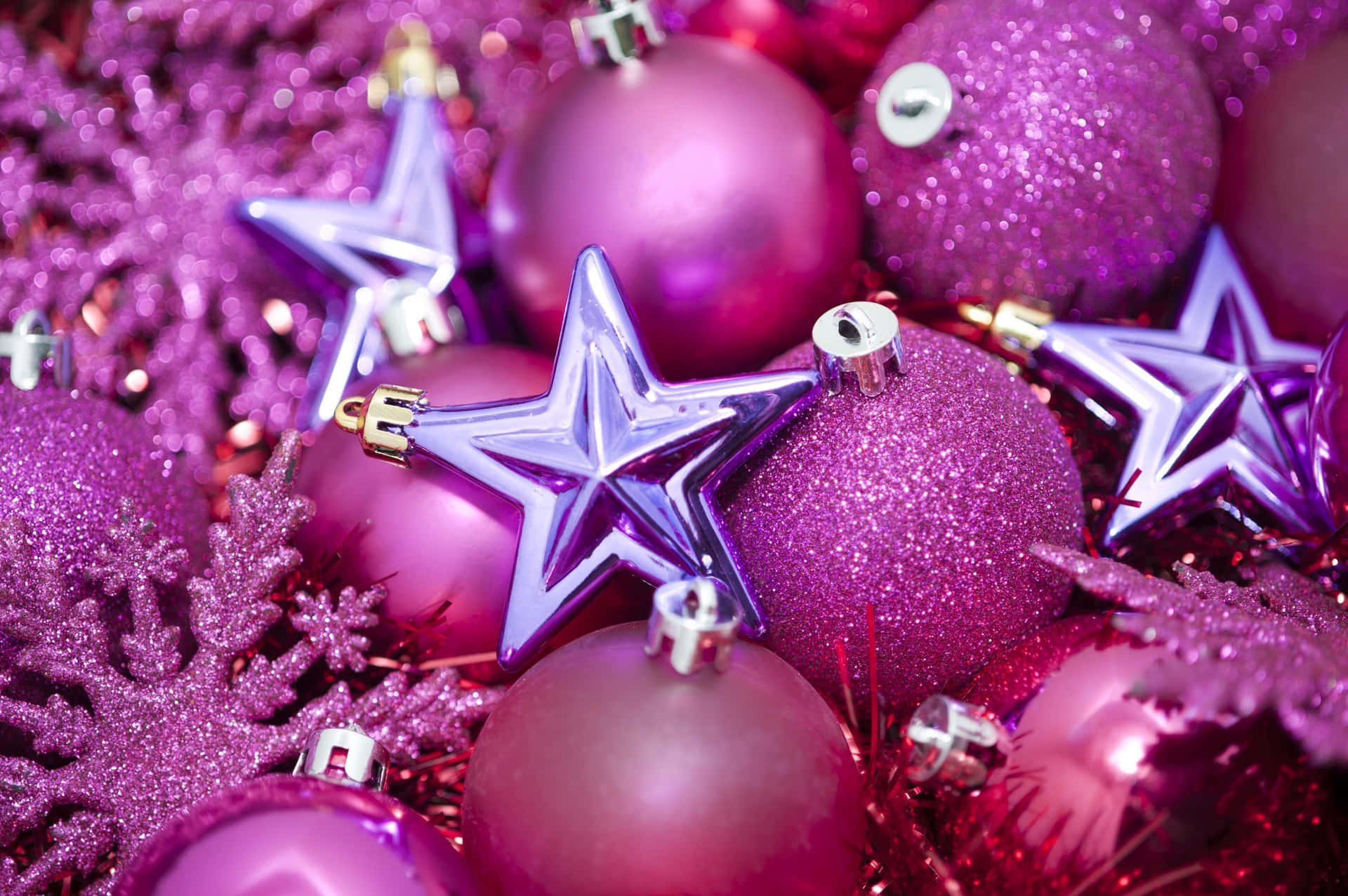 A Purple Christmas Tree With Stars And Ornaments Background