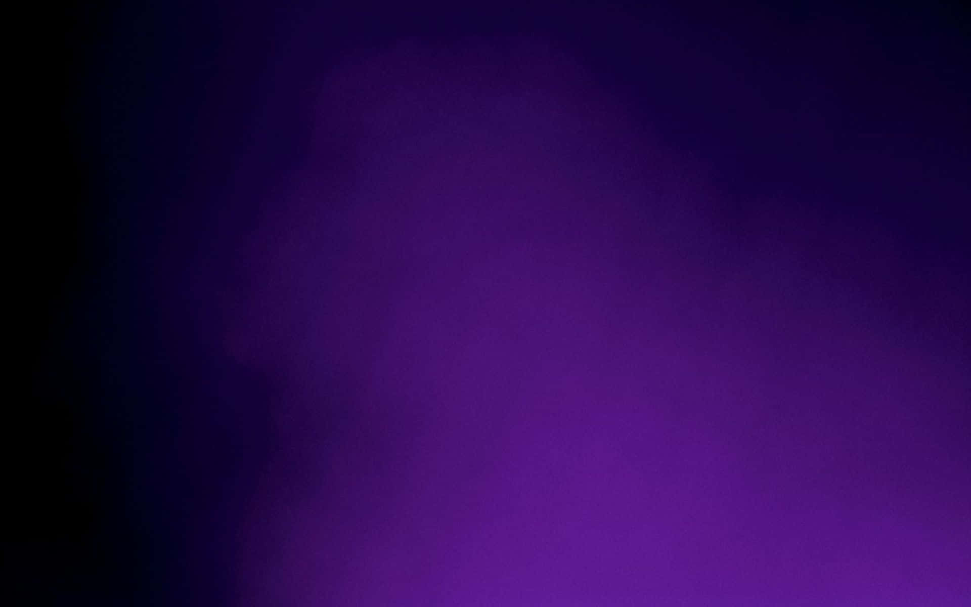 A Purple Light Is Shining On A Black Background Background