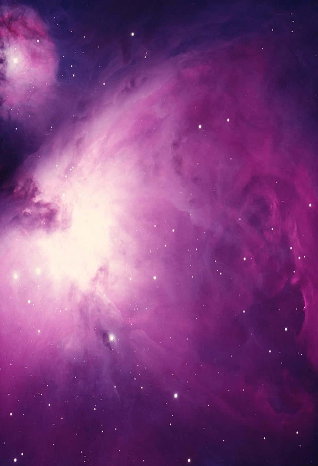 A Purple Nebula With Stars In The Background Background