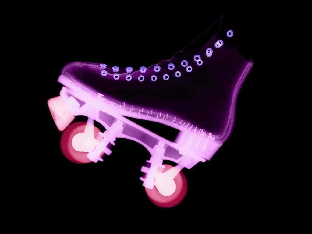 A Purple Roller Skate With A Black Background Background