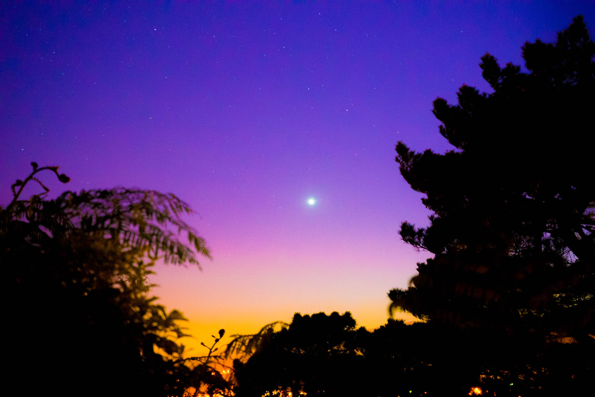 A Purple Sky With A Moon And Stars Background
