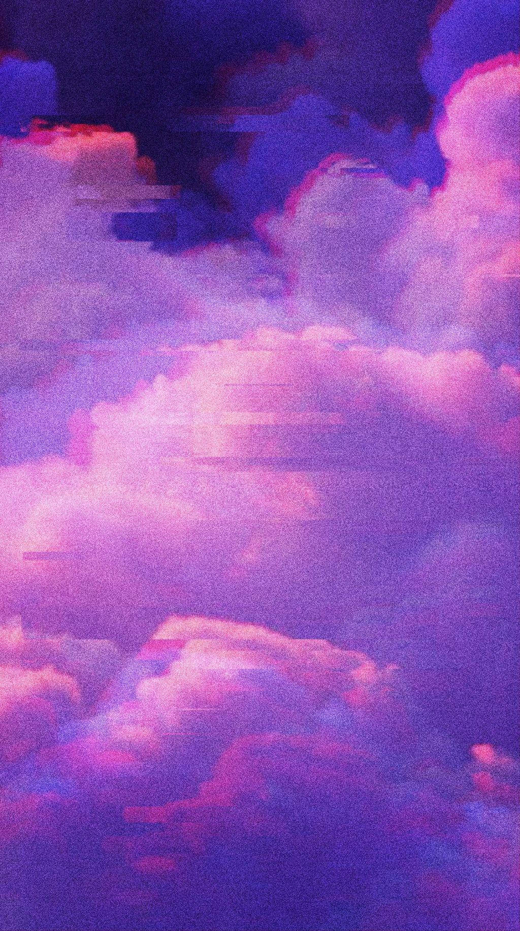 A Purple Sky With Clouds Background