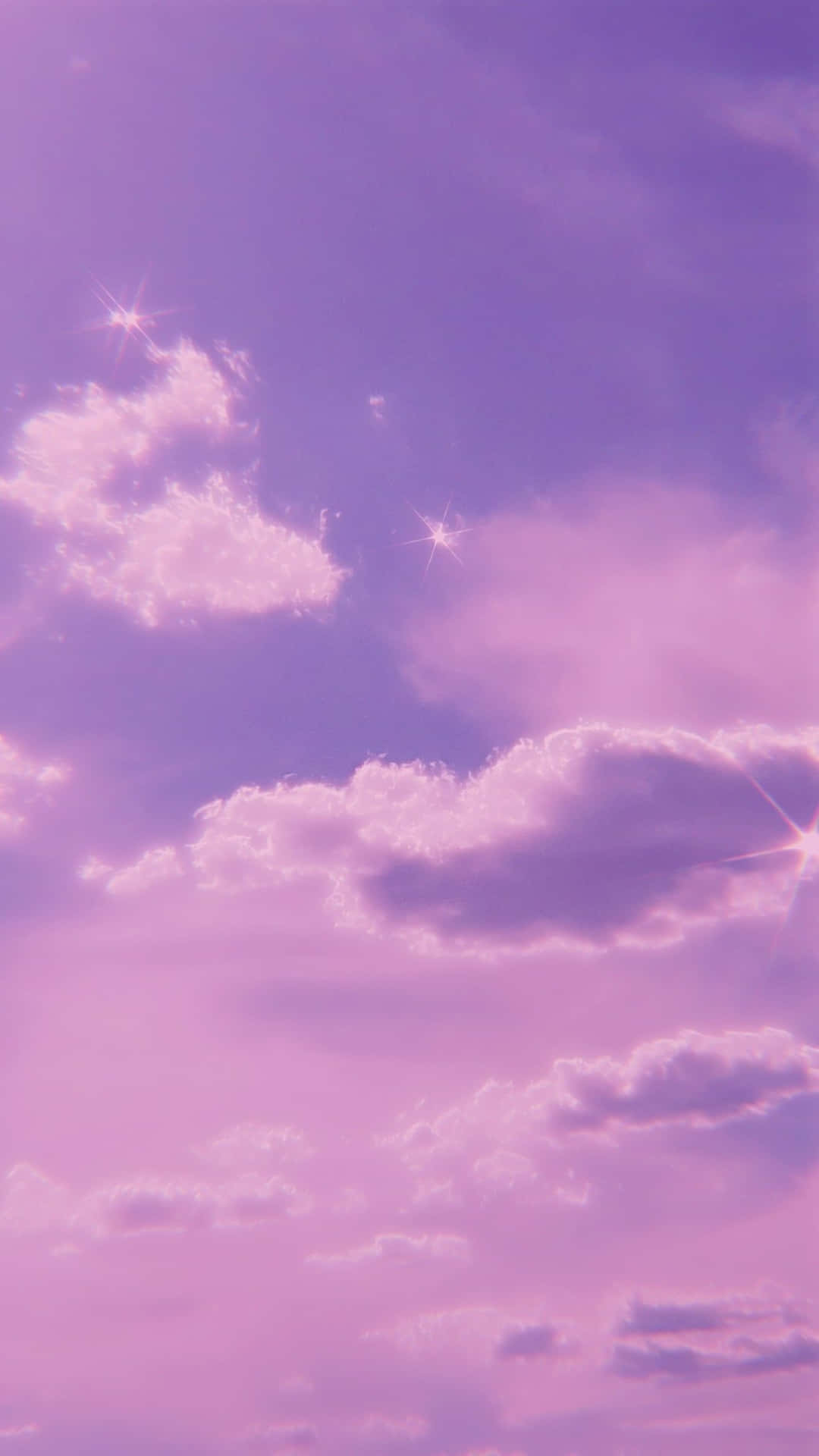 A Purple Sky With Clouds And Stars Background