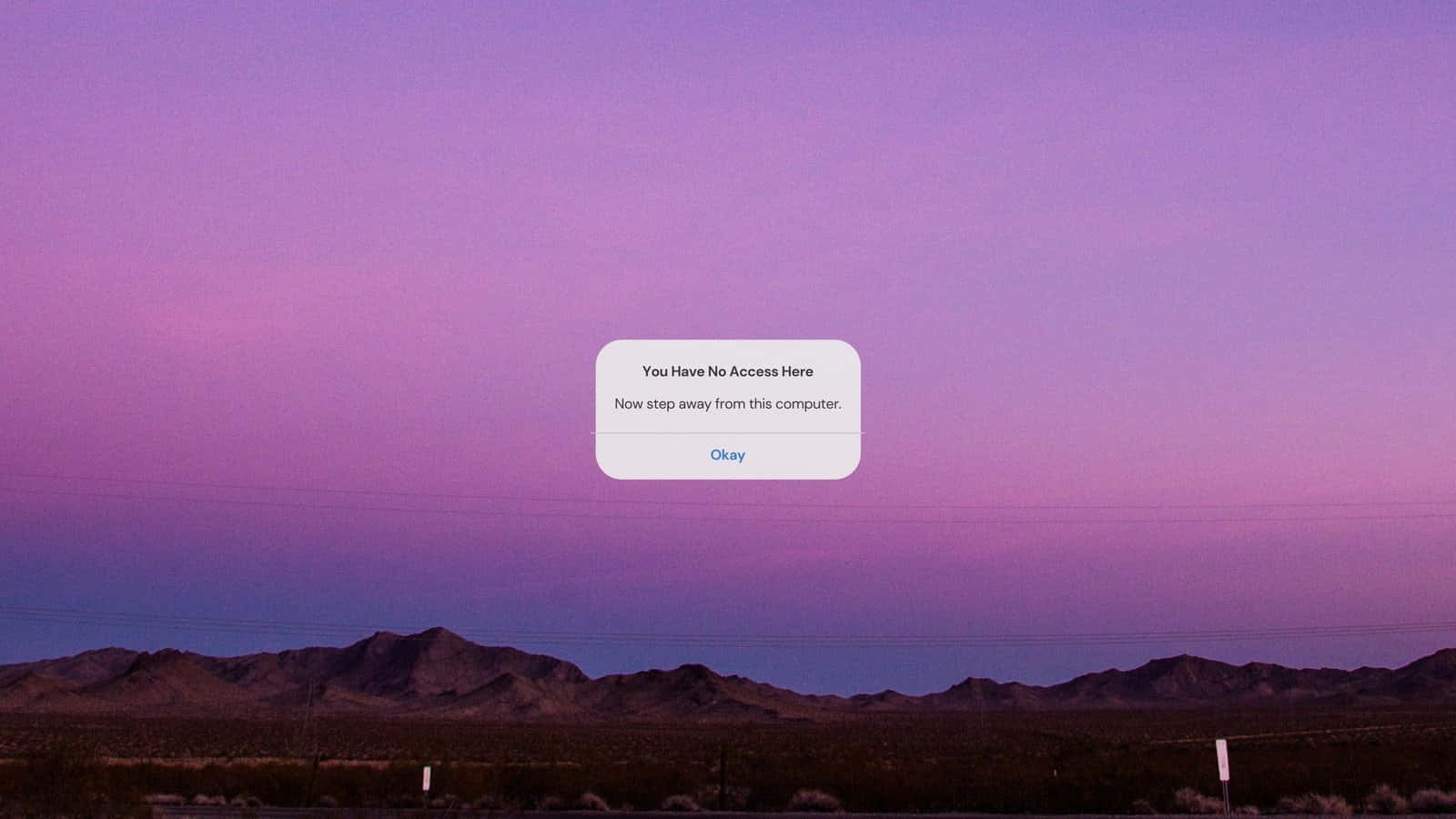 A Purple Sky With Mountains In The Background Background