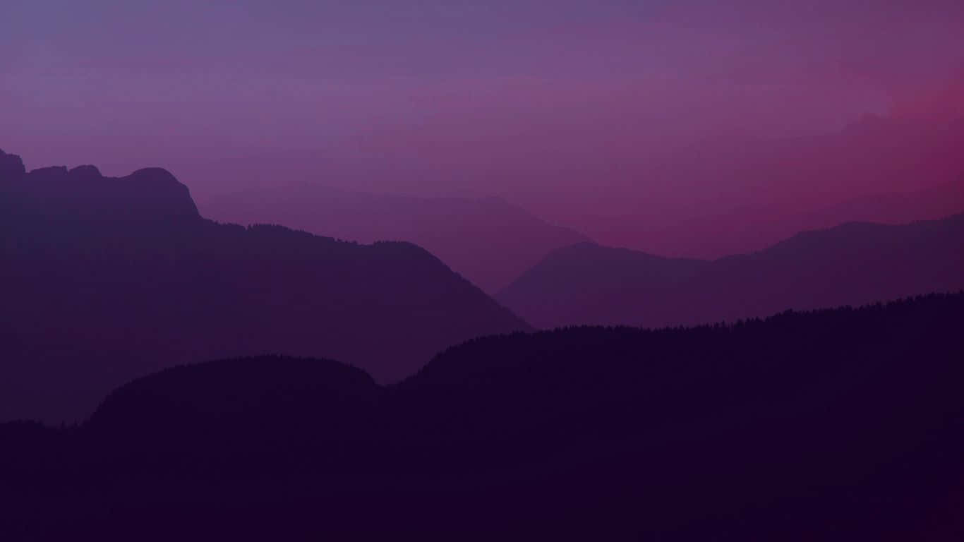 A Purple Sky With Mountains Background