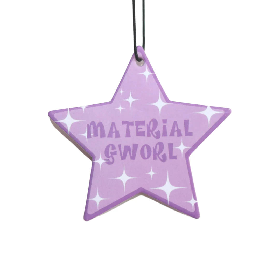 A Purple Star Ornament With The Word Material Swoosh Background