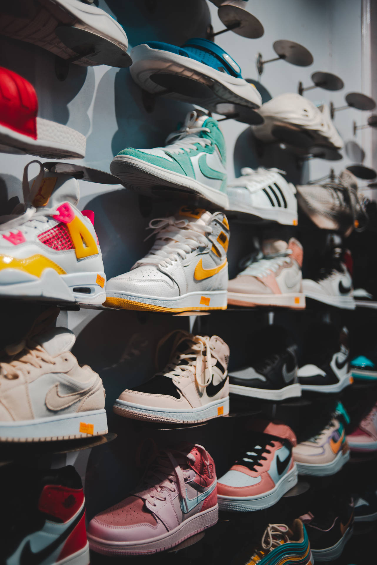 A Rack Of Shoes On A Shelf Background