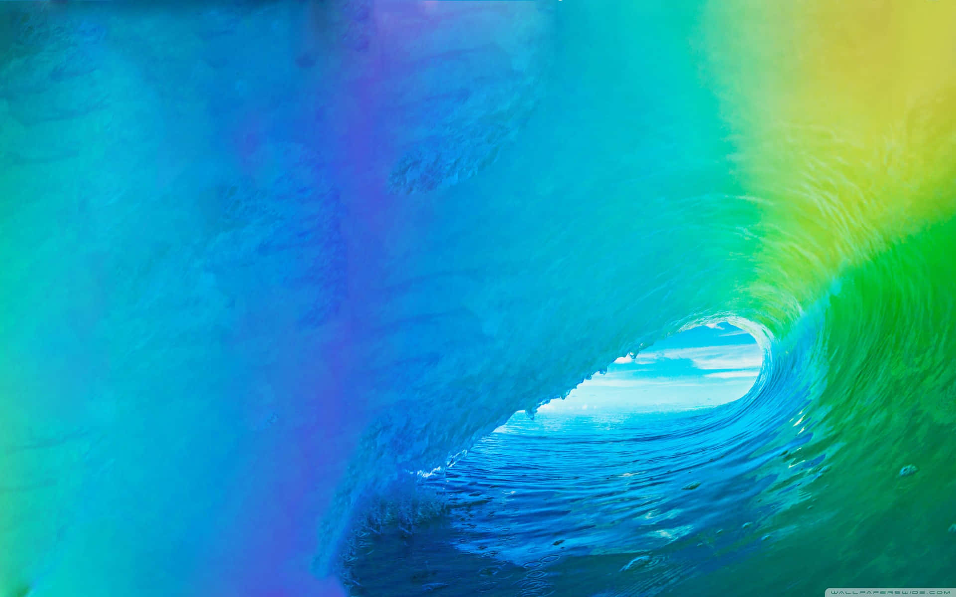 A Rainbow Colored Wave In The Ocean