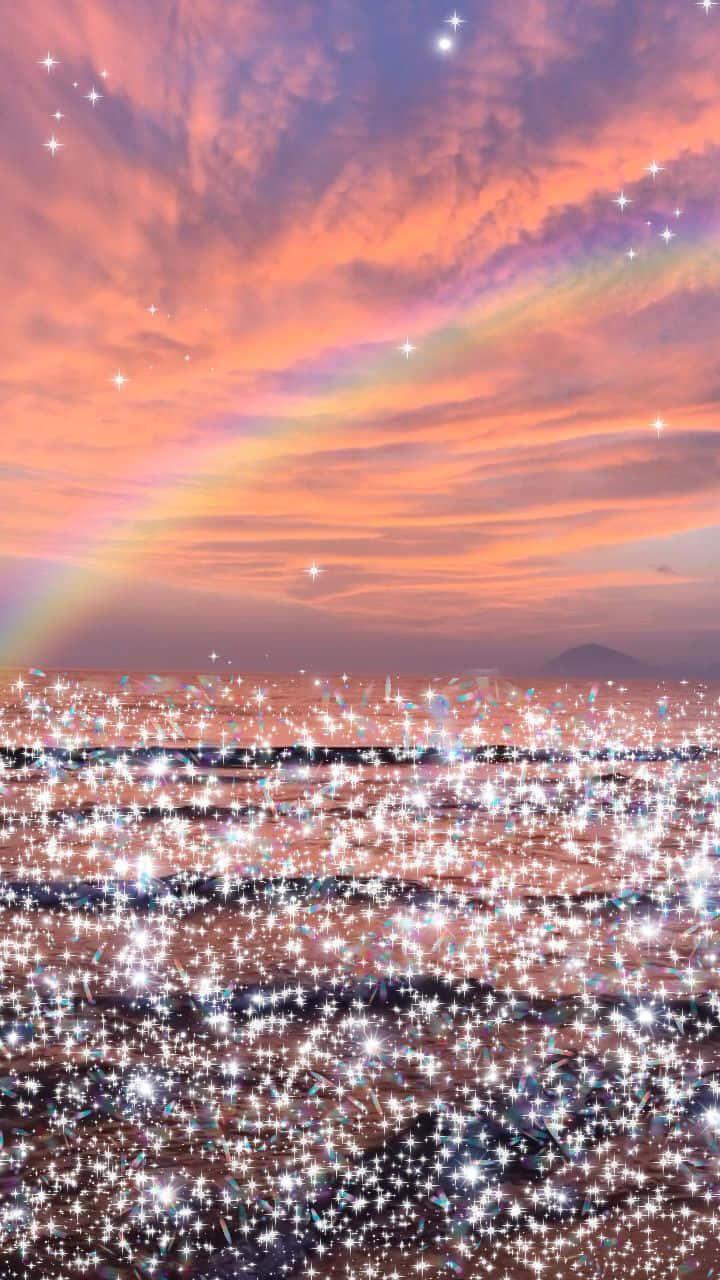 A Rainbow Over The Ocean With Stars Background