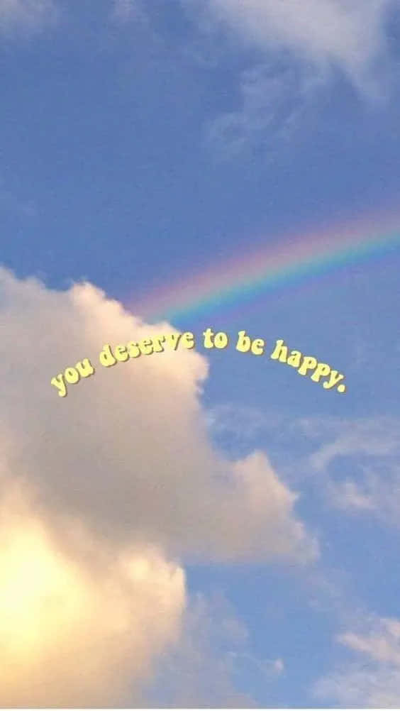 A Rainbow With The Words You Deserve To Be Happy Background