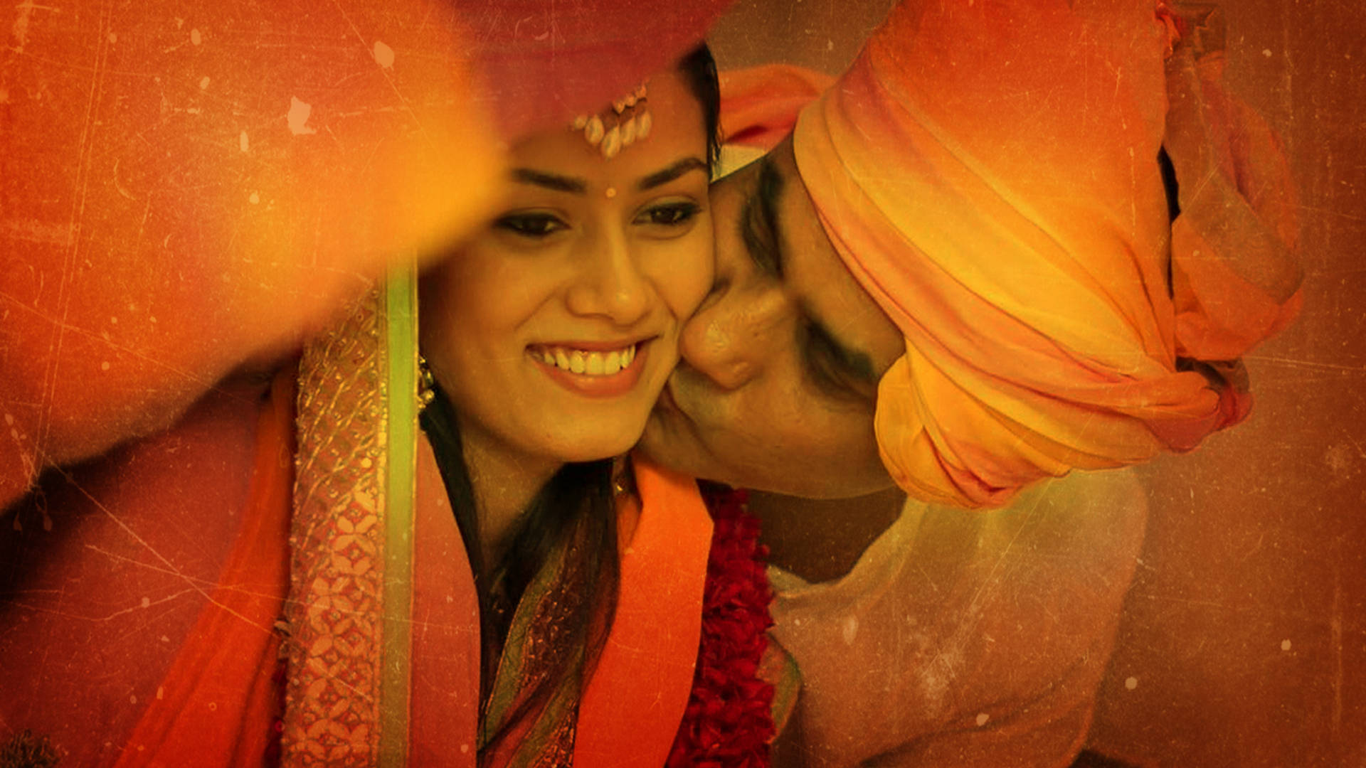 A Rajputana Romance - Man Kissing Woman In Traditional Attire Background