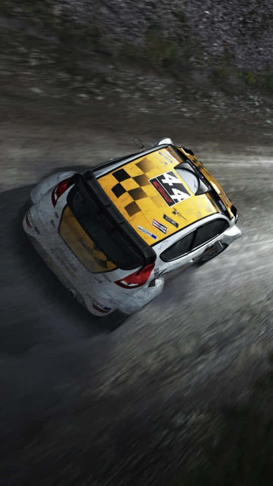 A Rally Car Driving Down A Dirt Road Background