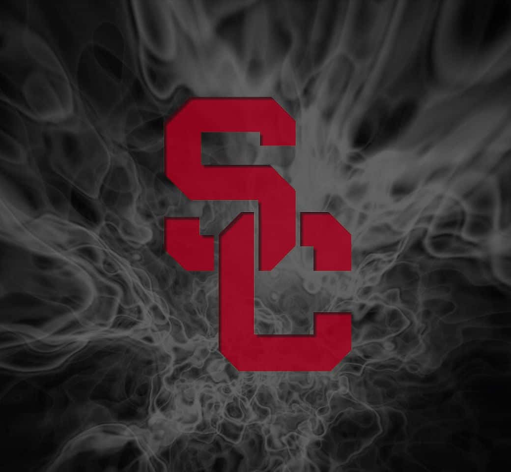 A Red And Black Logo With Smoke In The Background Background
