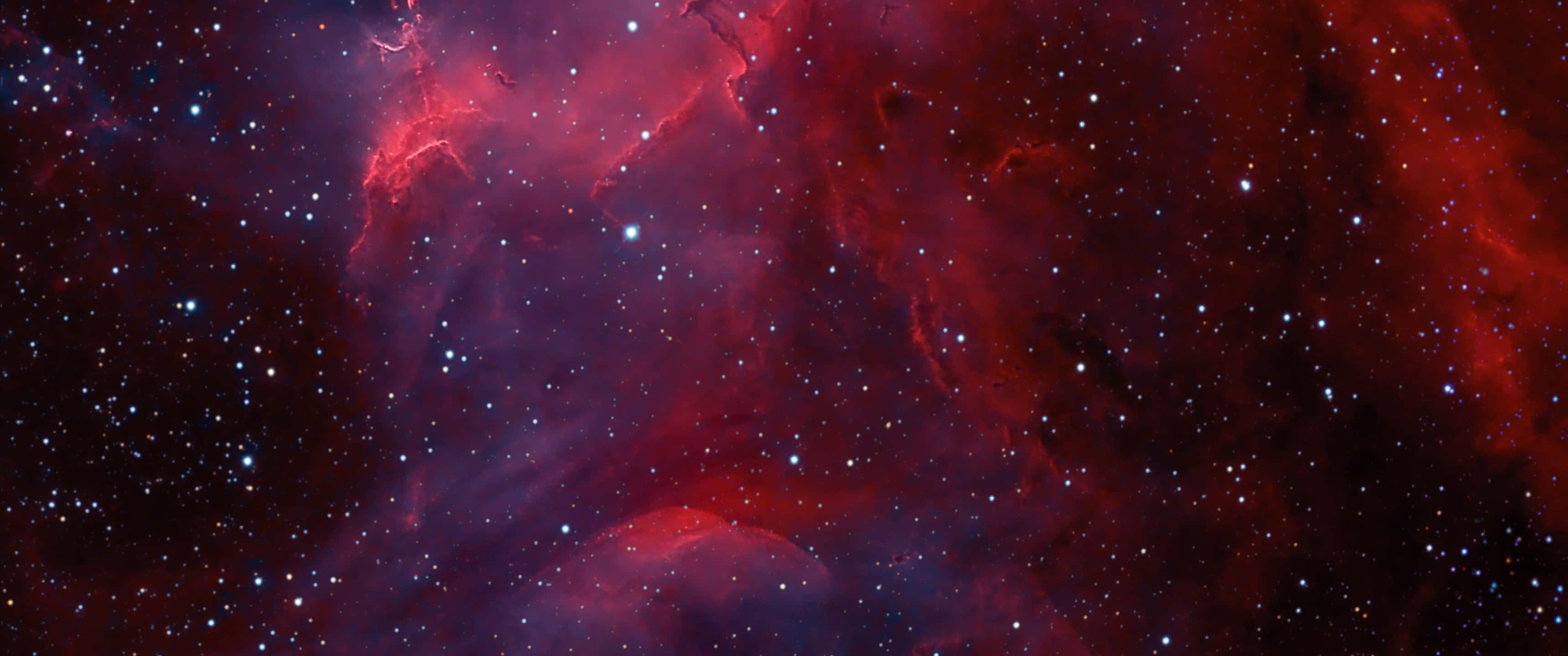 A Red And Blue Nebula With Stars In The Background Background