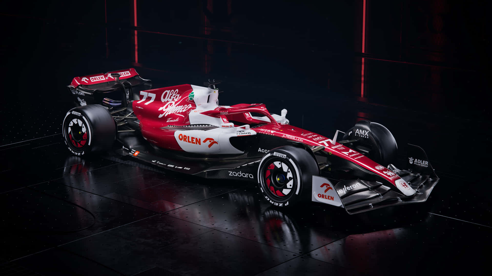 A Red And White Racing Car In A Dark Room Background