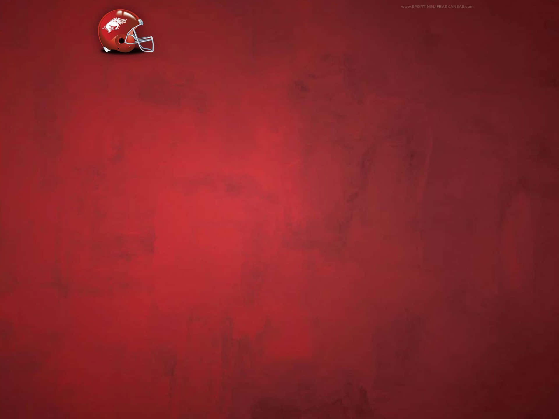 A Red Background With A Football Helmet On It Background