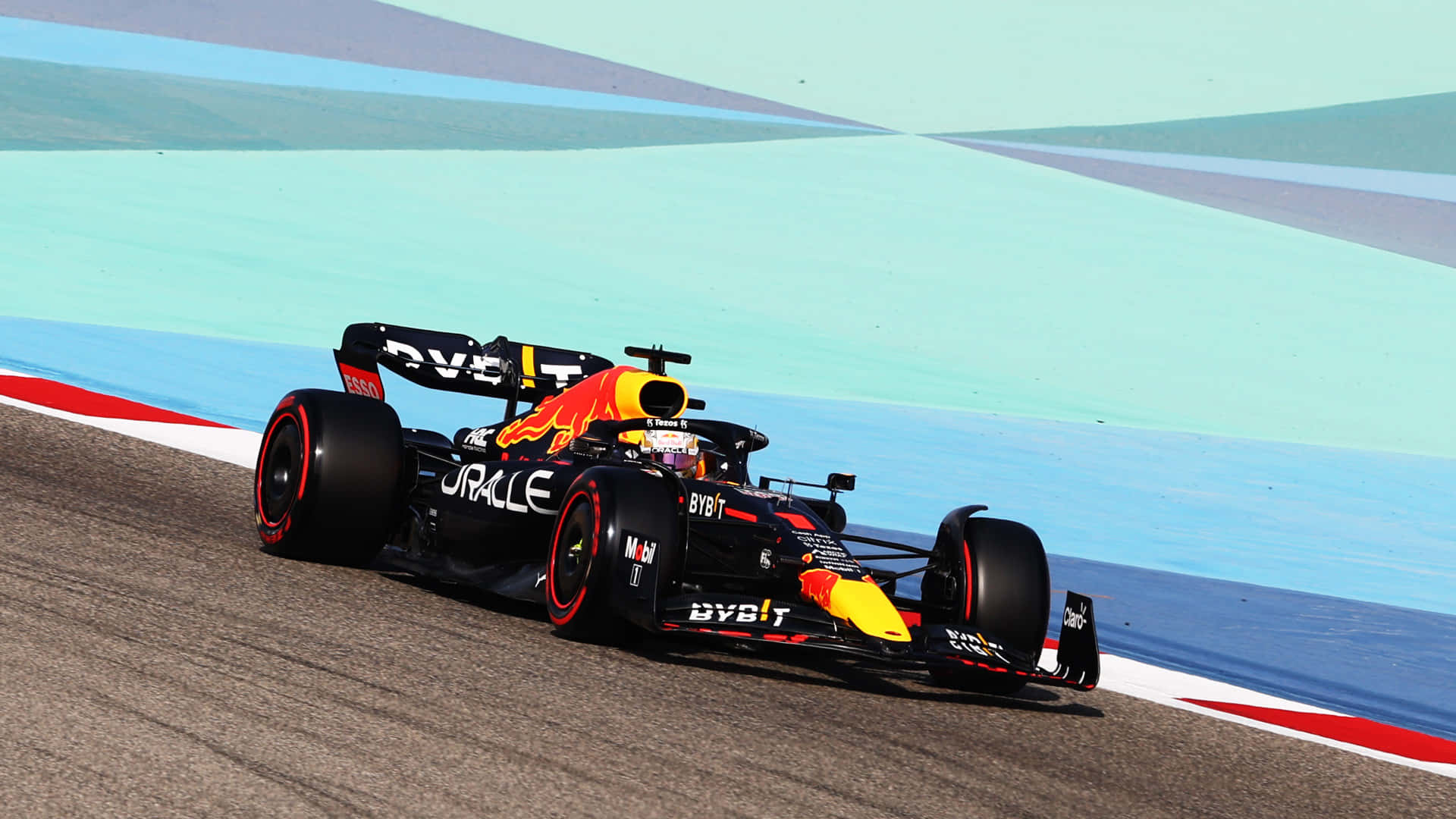 A Red Bull Racing Car On A Track Background