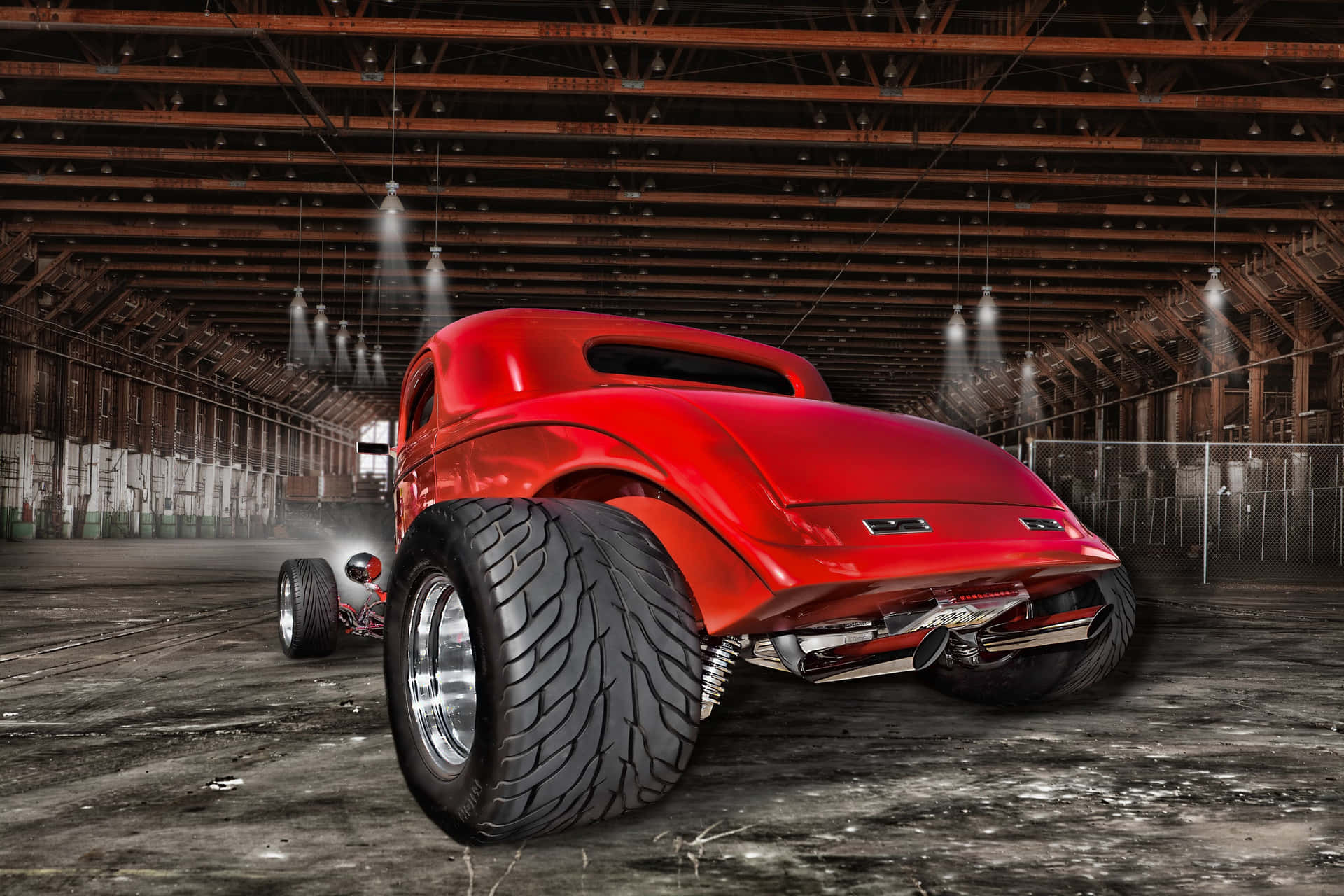 A Red Car In A Garage Background