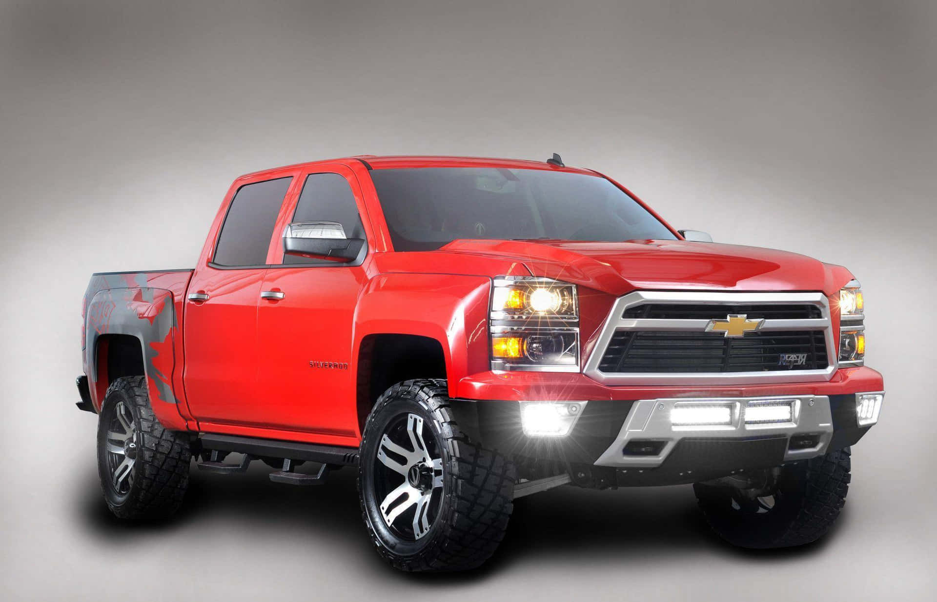 A Red Chevrolet Silverado Truck Is Shown In A Gray Background Background