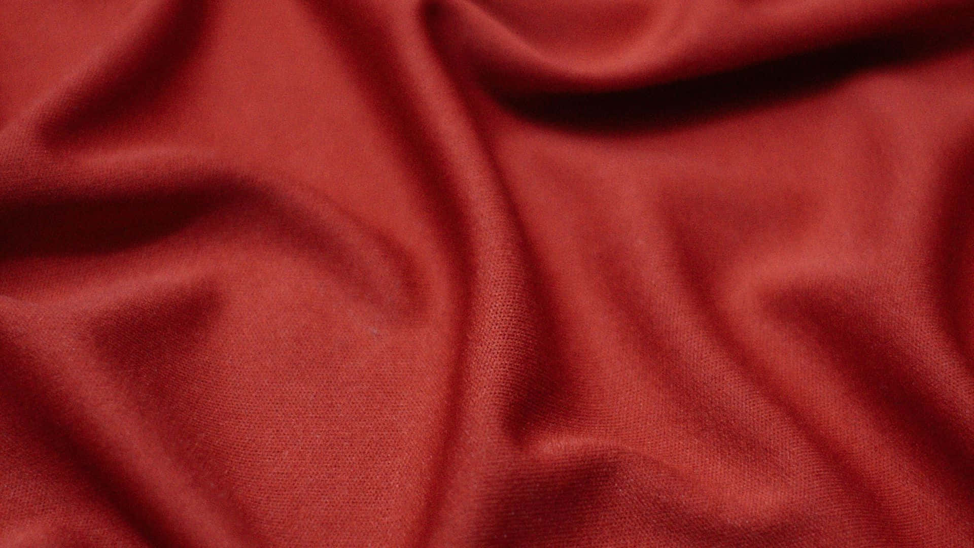 A Red Fabric With A Smooth Texture