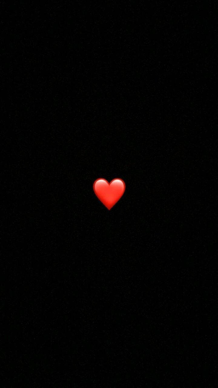 A Red Heart Is Lit Up In The Dark