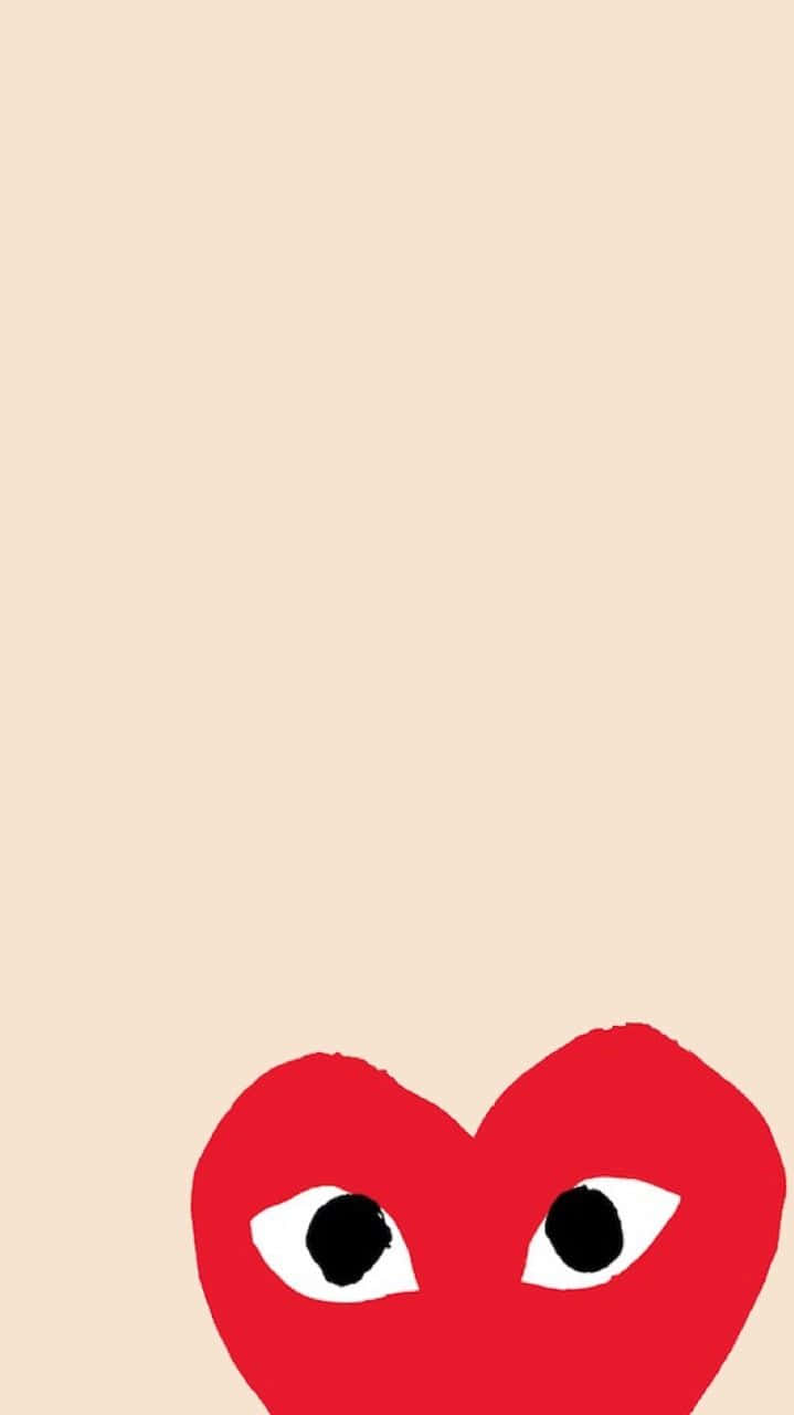 A Red Heart With Black Eyes On A Beige Background