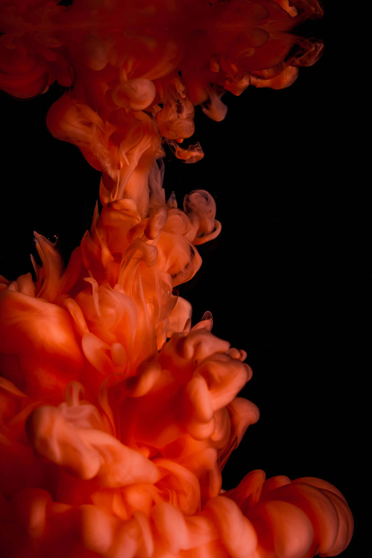 A Red Liquid Is Floating In A Black Background Background